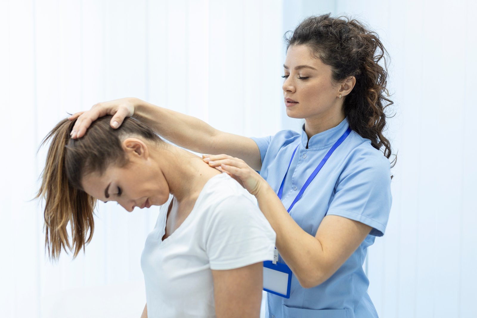 Chiropractor treating a patient's neck